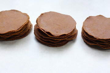 Fermented soybean discs, known as “Thua Nao,” a traditional Thai seasoning used to enhance flavor in Northern cuisine.