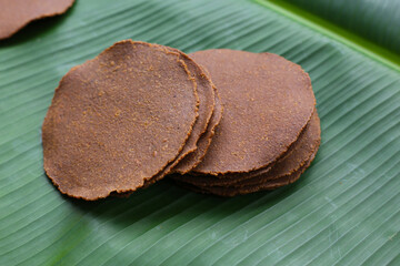 Fermented soybean discs, known as “Thua Nao,” a traditional Thai seasoning used to enhance flavor in Northern cuisine.