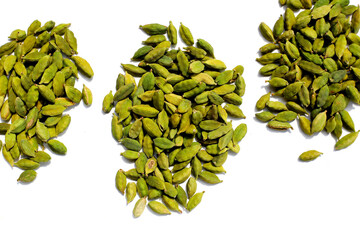 Green cardamom pods with aromatic and medicinal benefits.