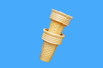 Empty wafer ice cream cones on a white background.