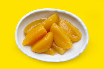 Sliced peaches in syrup served in a bowl