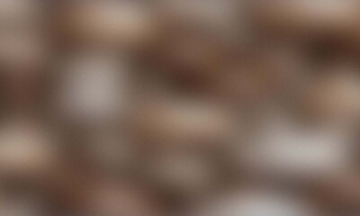 Close up abstract brown and white textured background pattern of pebbles and stones