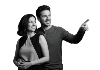Smiling couple pointing together in black and white isolated on transparent background