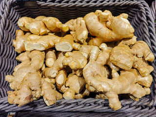 Fresh Organic Ginger Roots in a Woven Basket for Culinary Use