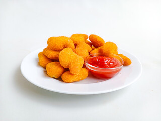 Chicken nuggets. Crunchy chicken nugget on the plate, isolated white background
