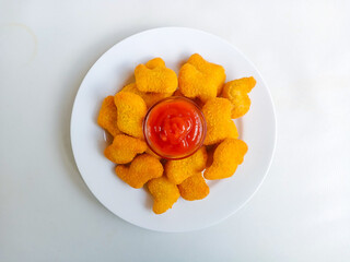 Chicken nuggets. Crunchy chicken nugget on the plate, isolated white background