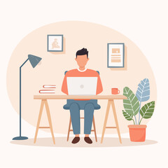 Young freelancer man working on a laptop computer at his desk in a comfortable and modern home office environment