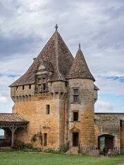 Fototapeta premium Vertical view of medieval Tour du Concierge or Caretaker Tower at Biron castle, Dordogne, France
