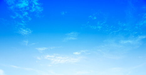 Fototapeta premium Cloudy blue sky abstract background, blue sky background with tiny clouds