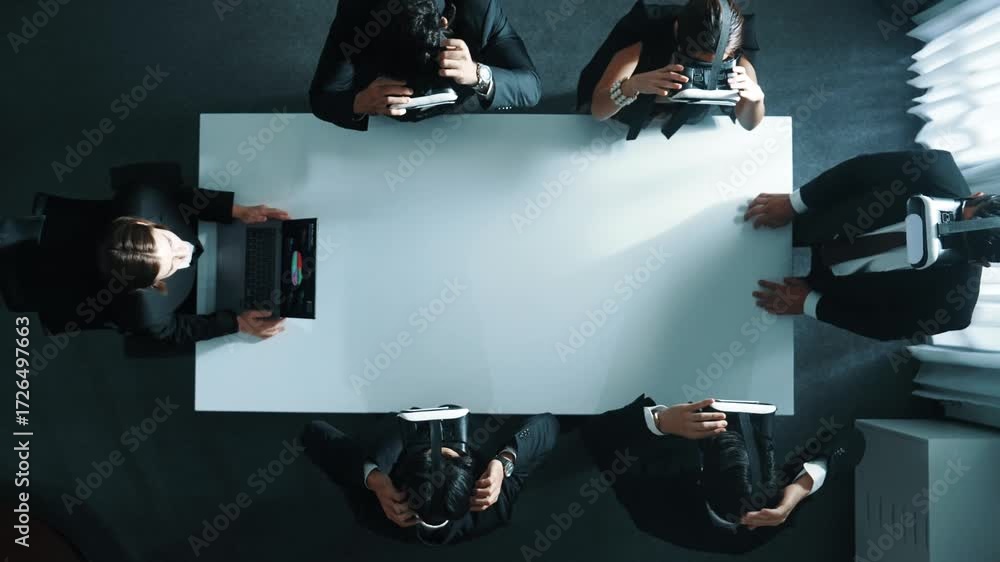 Poster top down aerial view of diverse data analysts wearing vr headset and stand around table while using 