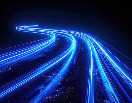 Blue light trails curving over dark terrain