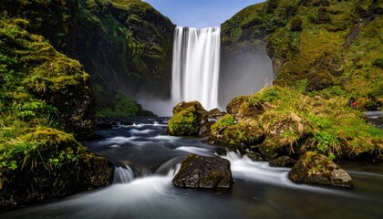 Majestic waterfall cascading over mossy rocks