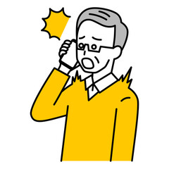 スマートフォンでの通話で驚く年配の男性