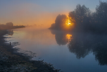 sunrise over the river with mist