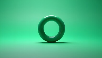Green torus with a glossy surface on a green background for abstract art design