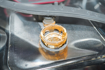 Kitchen dishwasher filter full of food scraps