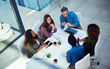 Above, business people and group brainstorming in office for budget, brand or stats document. Top...