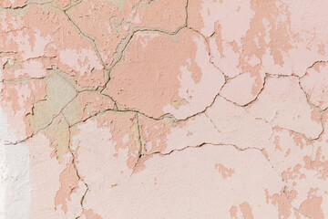 Obraz premium A wall with a pinkish color and some cracks