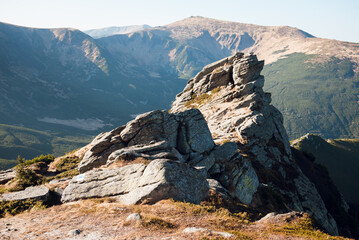 Rugged Mountain Peak with Distant Hills