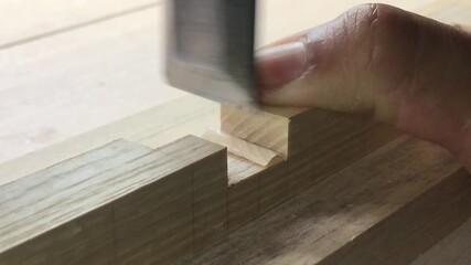 Refining a woodworking joint with a chisel and mallet