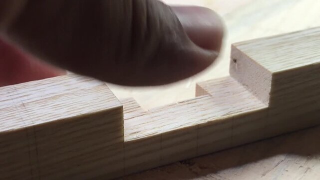 Refining a woodworking joint with a chisel and mallet