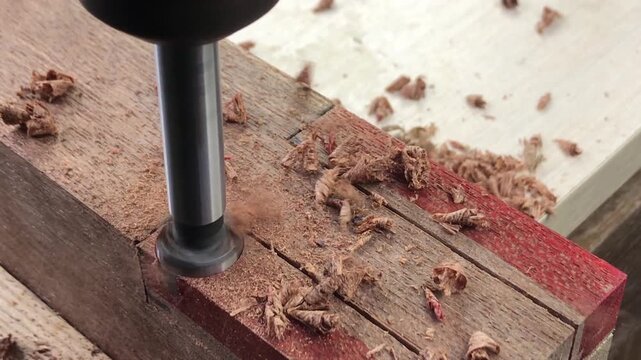 Cutting intricate shapes in woodworking using a drill bit