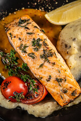 Grilled salmon fillet with herbs and vegetables