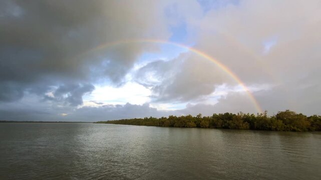 4k 60p uhd video footage of a double rainbow seen in the Sundarban National Park of West Bengal in India after a heavy spell of monsoon rain