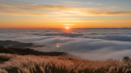 Fototapeta premium Breathtaking sunrise over clouds and mountains creating a dreamlike landscape with golden light shining through, perfect for travel and nature themes