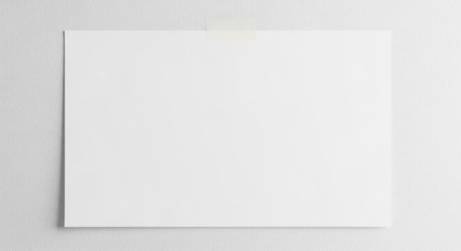A photo of a blank paper poster with tape attached to the wall/壁にテープで留めた白紙ポスターの写真