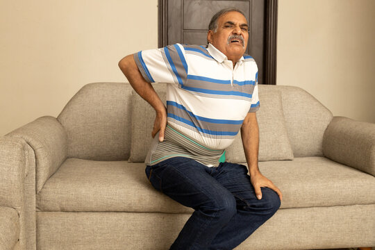 Indian senior male having health issues and body pain suddenly at home