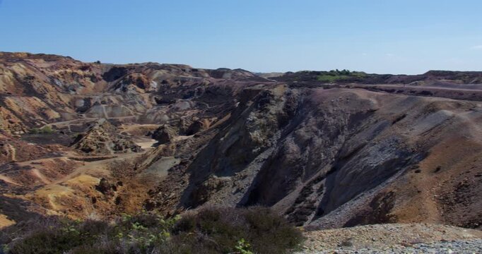 Extra Wide panning shot looking up the Great opencast mine at mynydd parys mountain copper mine.