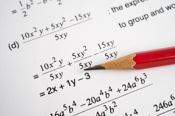 Pencil on mathematic formula exercise test paper in education school.