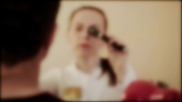 Female ophthalmologist doctor examines the fundus of a male patient, blurred, background. Copy space for text, clarity of vision