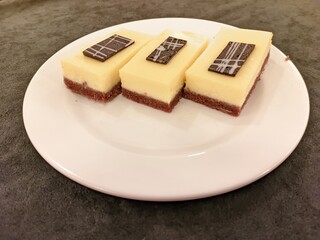 Delicious cheesecake slices served on a white plate