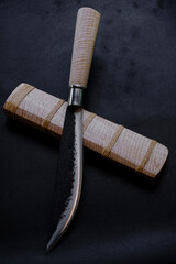 Enep knife of a Thai native. Sheaths made of tiger pattern wood