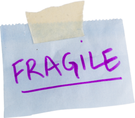a Fragile label with paper tape isolated on white background, handle with care note on torn paper 