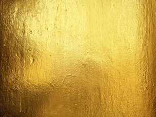 Gold Paint on Concrete Wall Texture Background.