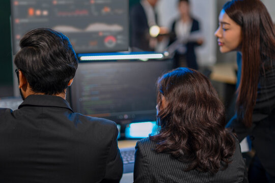 Group of programmers are coding at office.