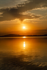 Obraz premium Bright, colorful summer sunset over Lake Mitkow in Poland. Evening landscape.