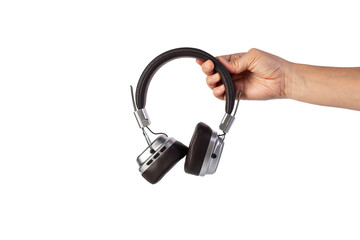 Two-tone silver and brown wireless headphones, Headphones and hand isolate on transparent background. Wireless headphones in brown.