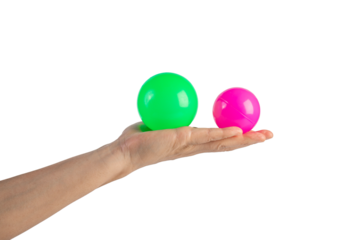Pink and green plastic ball in hand, transparent background
