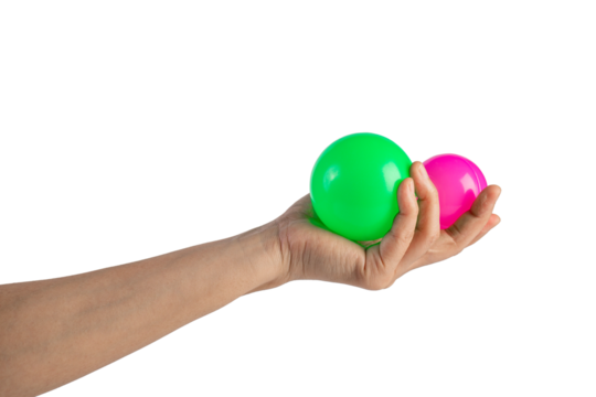 Pink and green plastic ball in hand, transparent background