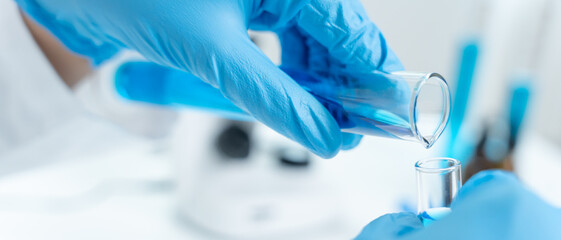 Scientist analyze biochemical sample in advanced scientific laboratory. Medical professional check...