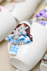 White mugs decorated with polymer clay fairy tale characters