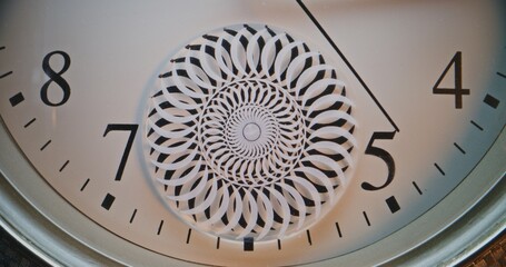 Close Up of Exquisite Wall Clock with Floral Mandala Ornament Captured in Detail Showing Precise Time. Unique Decorative Design Symbolizing Creativity, Precision, Punctuality, Symbolic Passage of Time