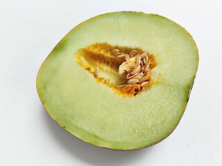 Vibrant Abstract Food Photography: The Inside of a Ripe Melon with Visible Seeds