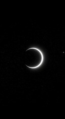Dramatic crescent moon shining brightly among distant stars in the vast night sky, perfect for astrology or celestial themes