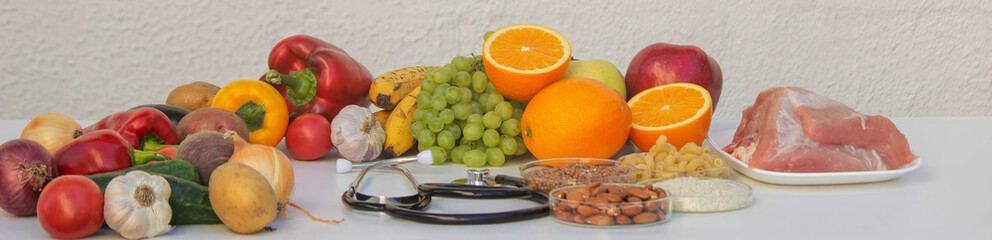 Healthy Eating and Medicine: Stethoscope, Fruits, Vegetables, and Grains