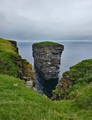 Wonderful views of the cliffs with islands and birds in the Scottish Highlands near Thurso